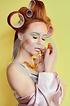 Young redhead woman with shugaring paste on her hands, face, body and chest