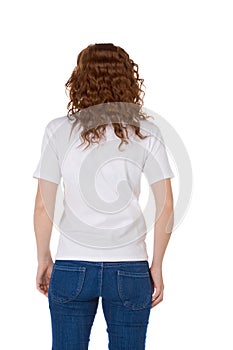 Young redhead woman in white polo shirt and jeans