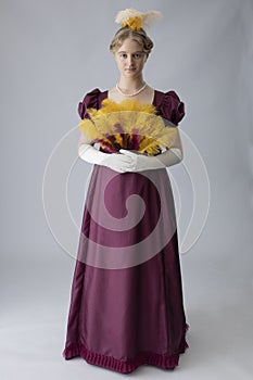 A young Regency woman in a an evening dress