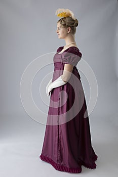 A young Regency woman in a an evening dress