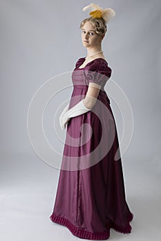 A young Regency woman in a an evening dress