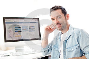 Young relaxed man using computer