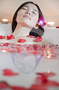 Young Relaxed Woman Bathing at Health Spa