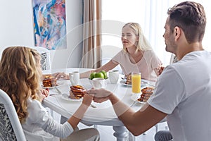 young religious family praying