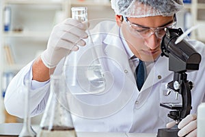 Young researcher scientist doing a water test contamination expe