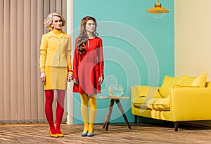 young retro styled women standing in colorful room doll