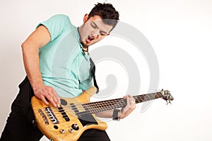 Young rocker with bass player with turquoise t shirt