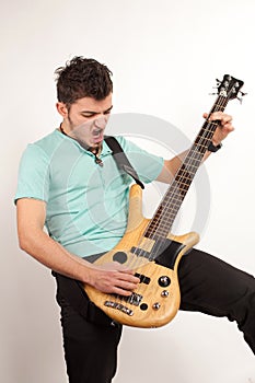 Young rocker with bass player with turquoise t shirt