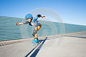 Young roller skater riding fast at rollerdrom