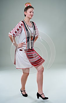 Young Romanian dancer in traditional costume