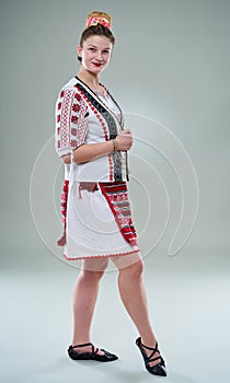 Young Romanian dancer in traditional costume