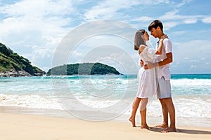young romantic couple on a beach, copy space left