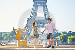 Young romantic couple in Paris near the Eiffel tower