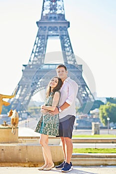 Young romantic couple in Paris near the Eiffel tower