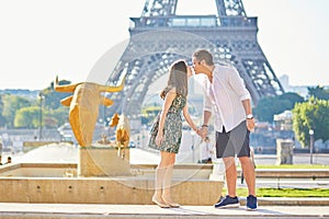 Young romantic couple in Paris near the Eiffel tower