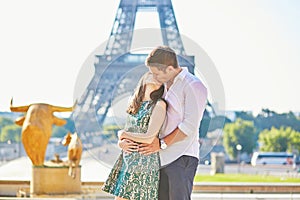 Young romantic couple in Paris near the Eiffel tower