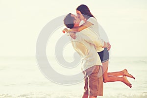 Young Romantic Couple Playing on the Beach