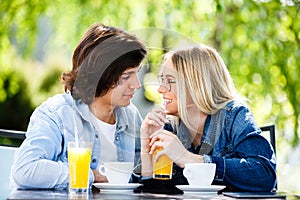 Young romantic couple spending time together - sitting in cafe`s