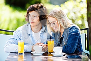 Young romantic couple spending time together - sitting in cafe`s