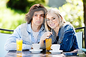 Young romantic couple spending time together - sitting in cafe`s