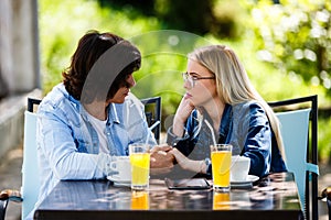 Young romantic couple spending time together - sitting in cafe`s