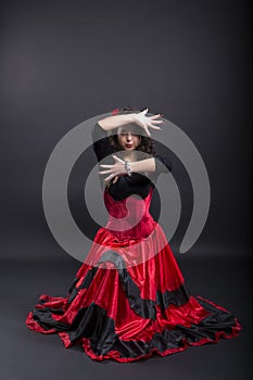 Young romany woman dance in spanish traditional clothes