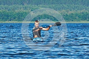 The young rower's training on the racing kayak