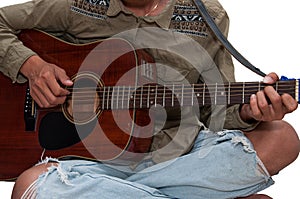 Young`s guitar playing happily on holiday.