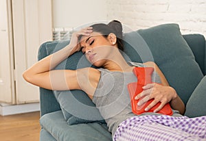 Young sad attractive woman having painful stomachache from perio