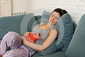 Young sad attractive woman having painful stomachache from perio
