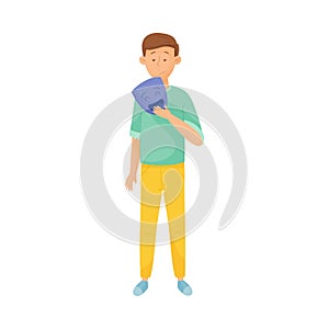 Young Sad Man Standing and Holding Mask with Happy Emotion in His Hands Vector Illustration