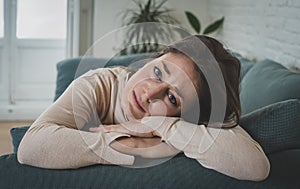 Young sad woman suffering from depression feeling desperate and lonely at home