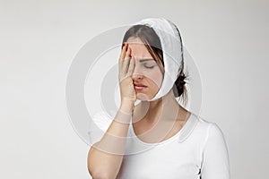 Young sad woman suffering from tooth pain