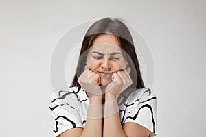 Young sad woman suffering from tooth pain