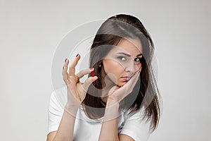 Young sad woman suffering from tooth pain