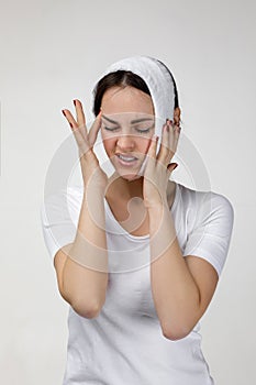 Young sad woman suffering from tooth pain