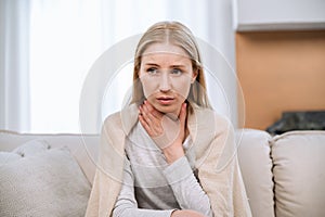 young sad woman with throat sore feeling unwell