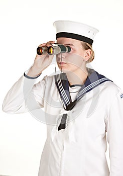 Young sailor with binoculars isolated white