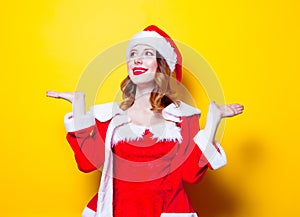 Young Santa Clous girl in red clothes