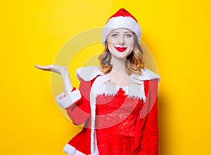 Young Santa Clous girl in red clothes