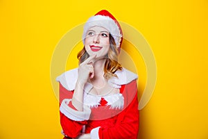 Young Santa Clous girl in red clothes