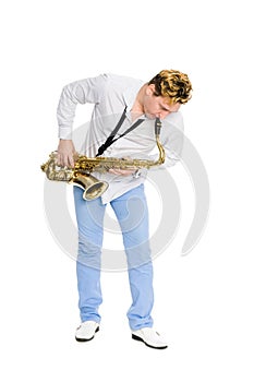 Young saxophonist plays the saxophone