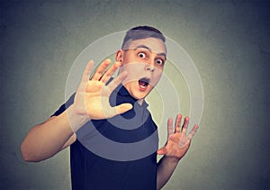 Scared man with shocked facial expression