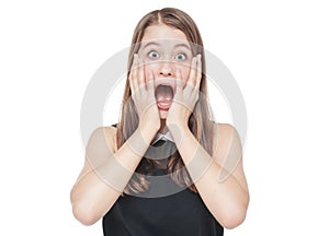 Young scared teenage girl covering her mouth with hand isolated