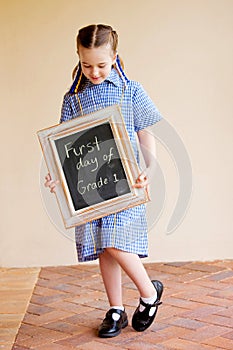 A young school girl on the first day off school