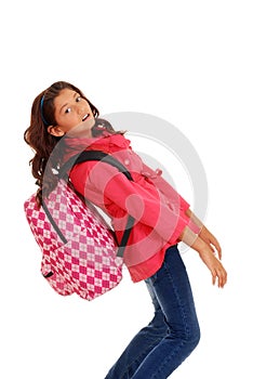 Young school girl with heavy backpack