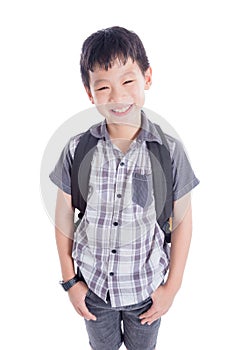 Young schoolboy with backpack smiling over white