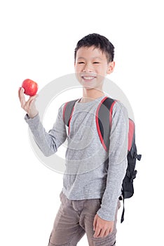 Young schoolboy with backpack smiling over white