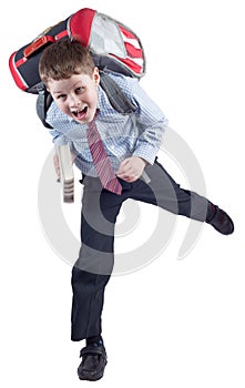 Young schoolboy with school bag in a hurry