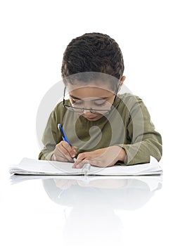 Young Schoolboy Studying with Concentration